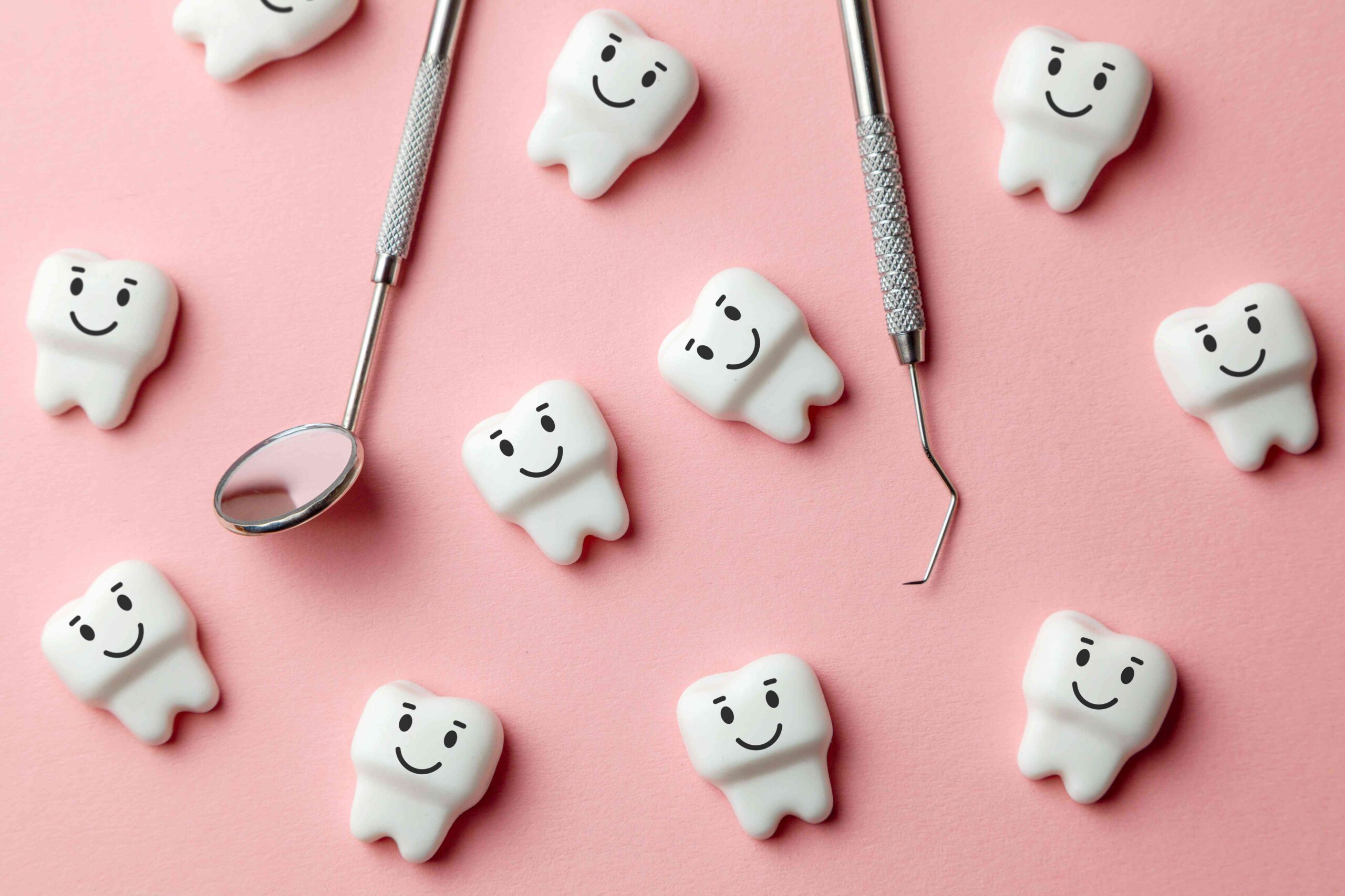 Happy teeth and dental tools.